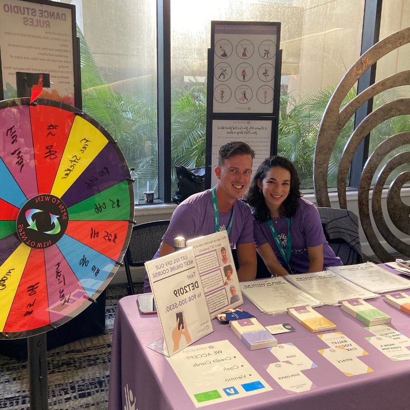 Dancers shown with array of dance resources and cards.